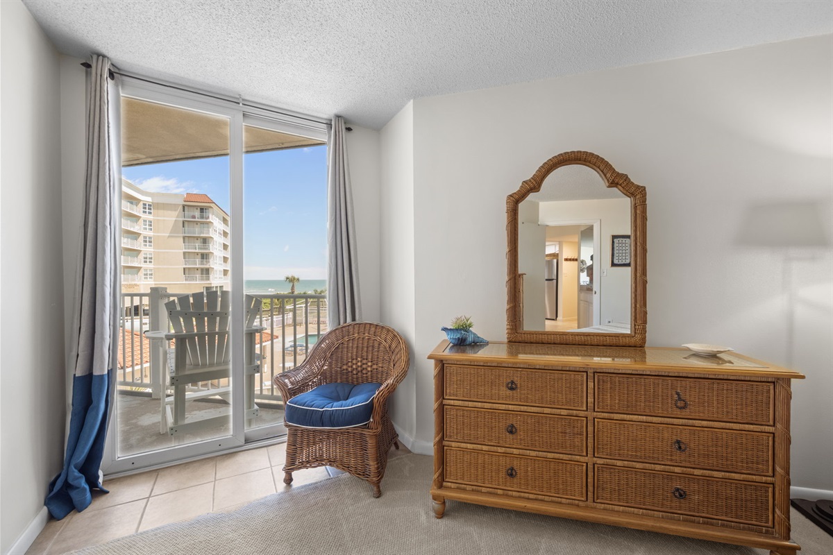 Morning light pours in through the balcony doors, creating a bright and airy feel