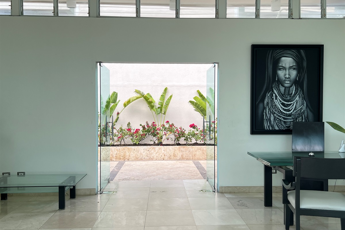 Bright walkway with garden views