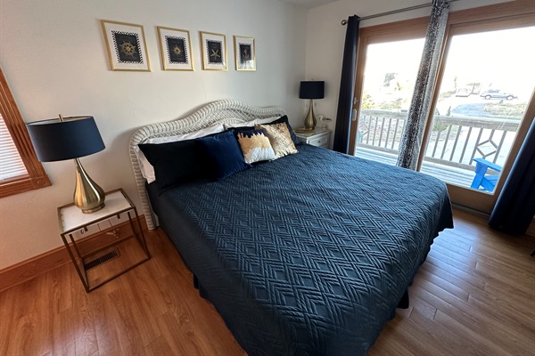 Serene King Master offering deck access through a windowed entrance, and equipped with a TV.