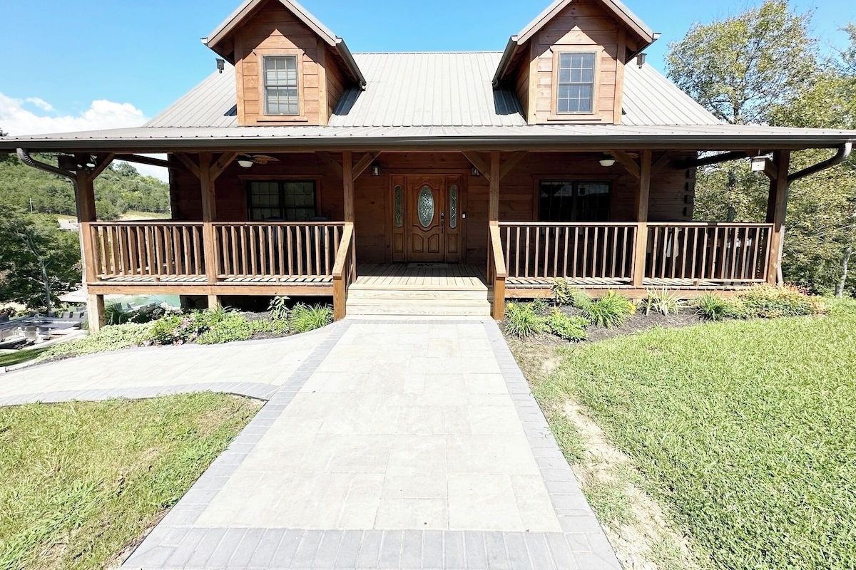 When you first arrive you have nice wide walkway to the front porch (with some Rocking chairs) and front door  or you can turn to the left and walk on the patios to around the back patios and back porches