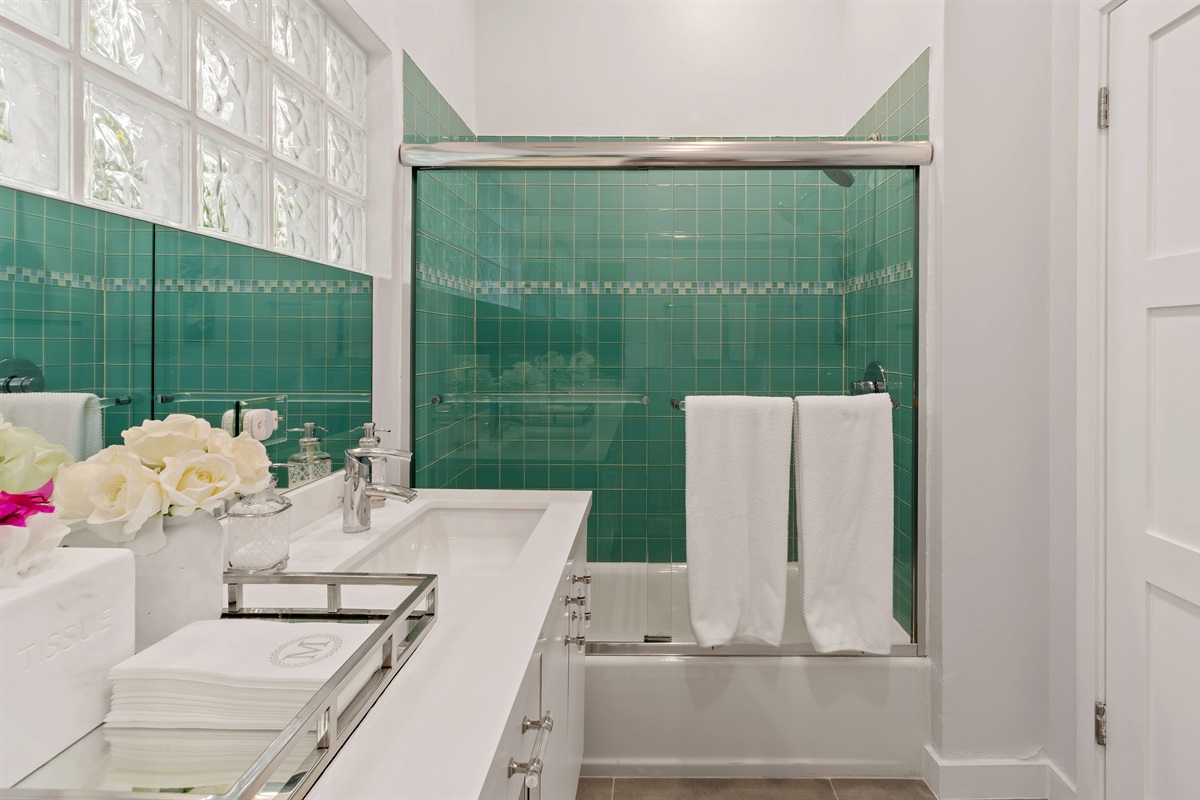 A gorgeous and well appointed bathroom on the lower level