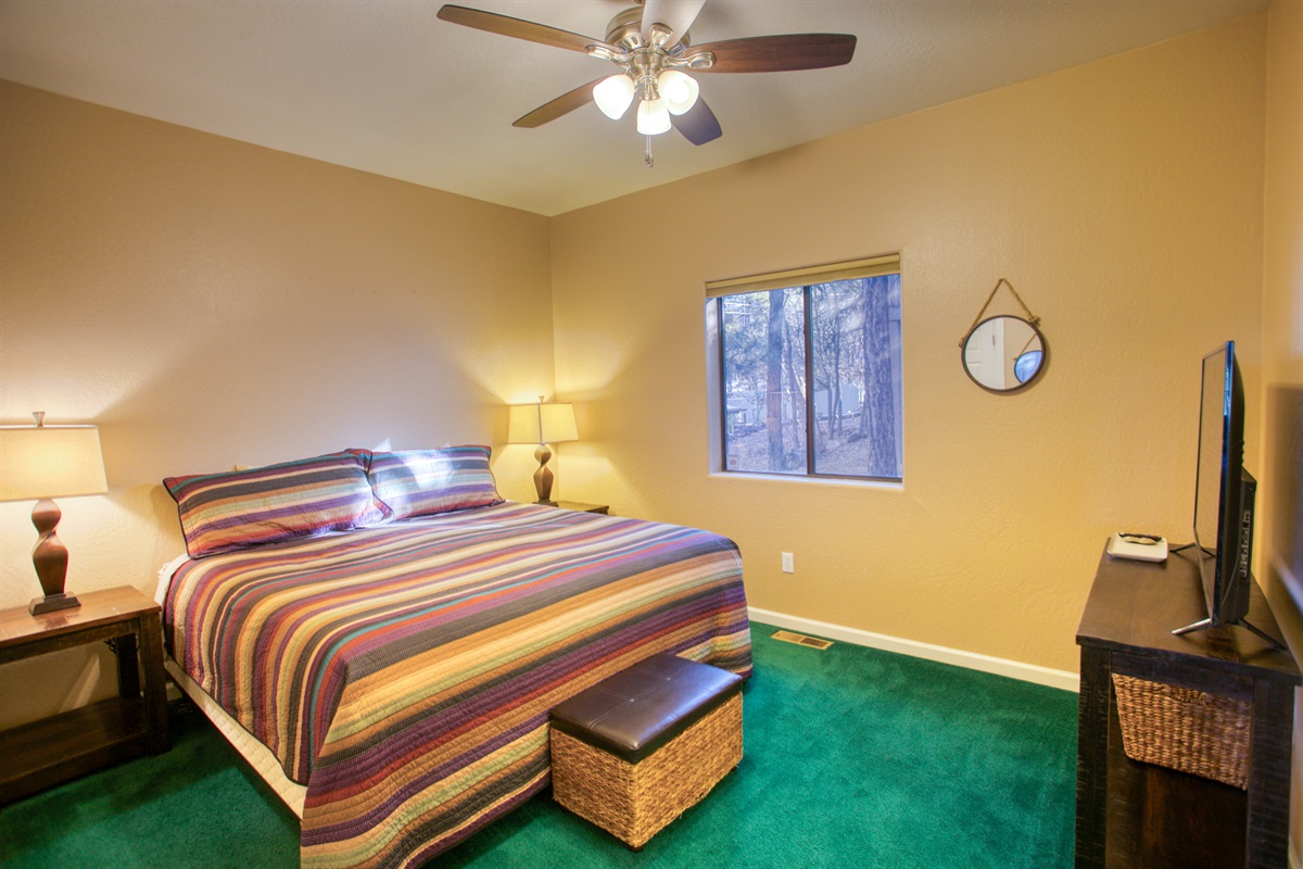 Relax in Bedroom 2, spacious, comfortable, and beautifully scenic.