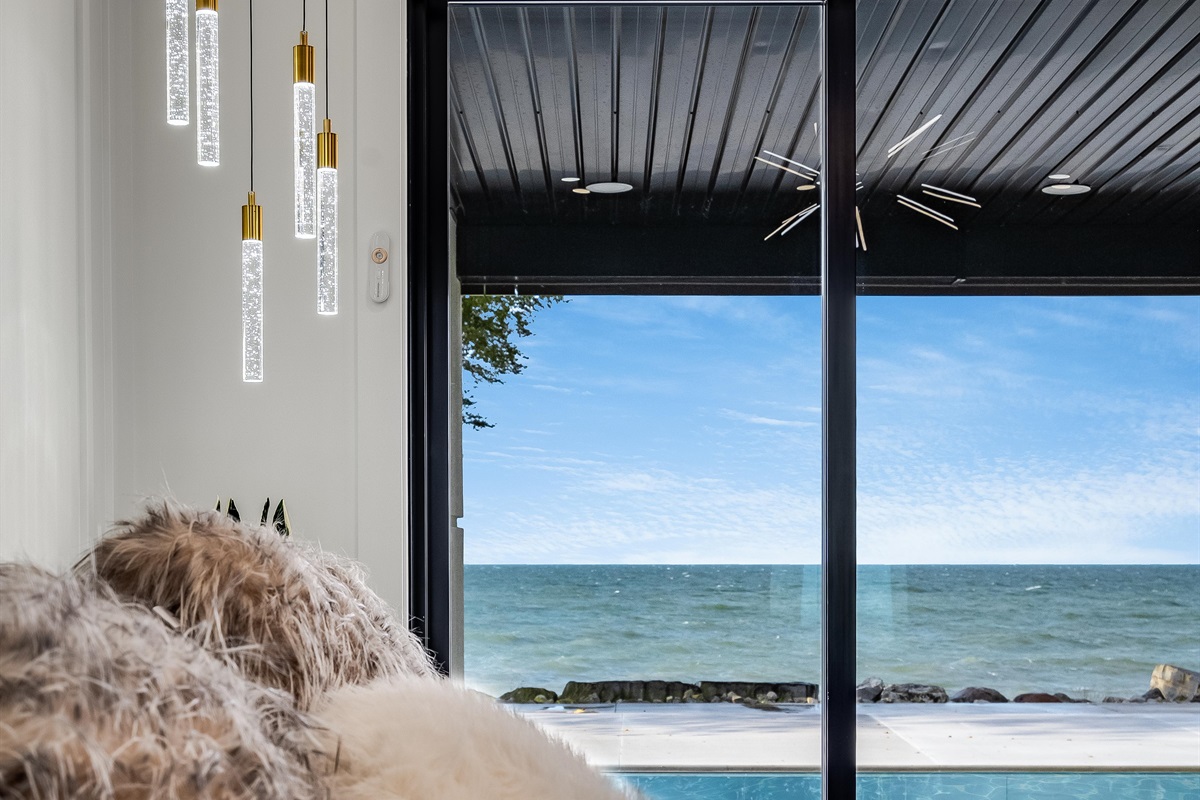 King Bedroom with Premier Master Suite on the main floor with patio access and lake views.