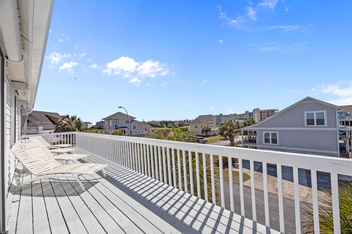 Spacious private balcony with lounge chairs, perfect for enjoying morning coffee or evening sunsets