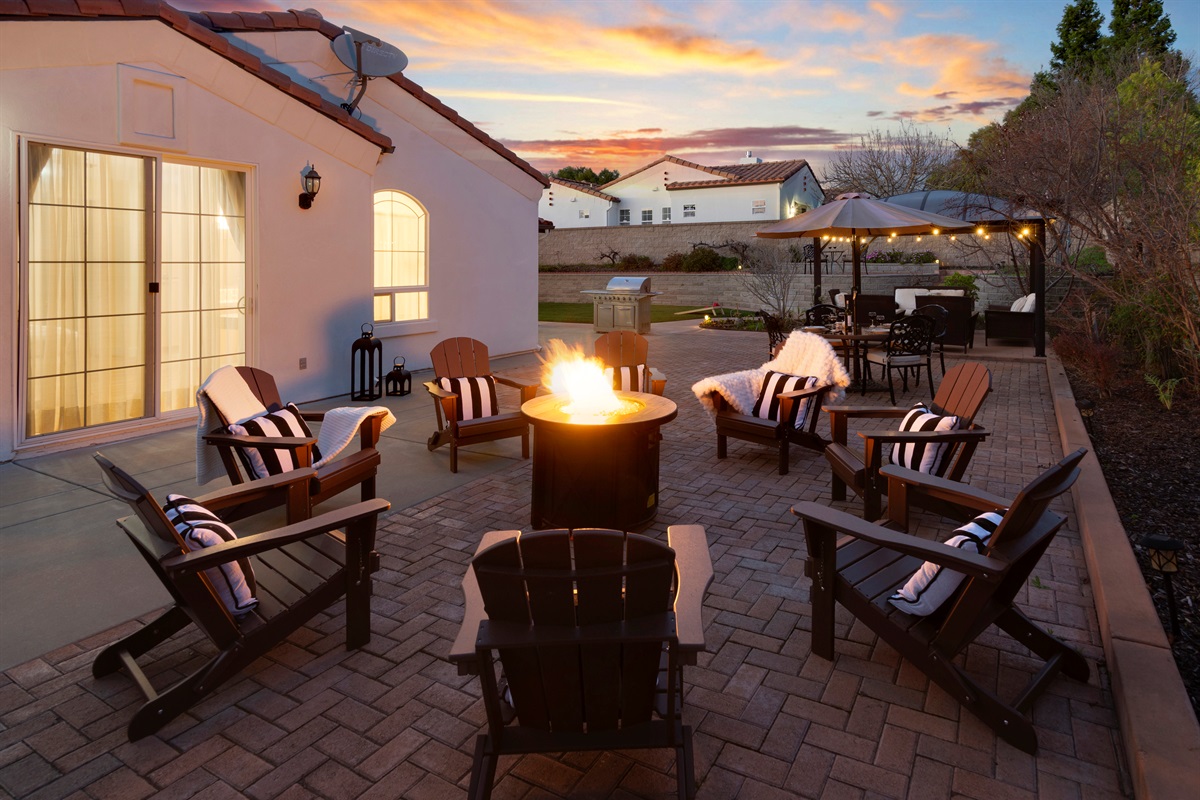 Gather around the fire pit under the sunset sky—perfect for relaxing evenings with family and friends