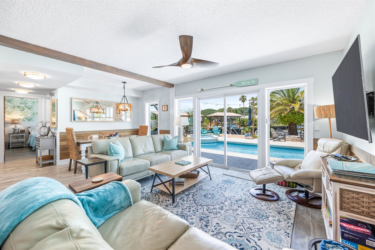 Living area and inside dining. View of pool, canal and lots of nice natural light. 