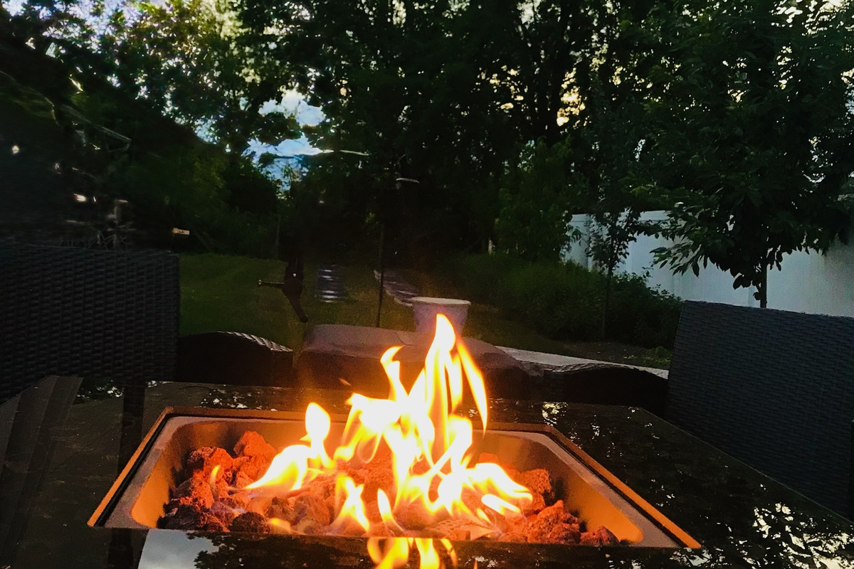 Gas firepit creates a cozy gathering place on the back patio.