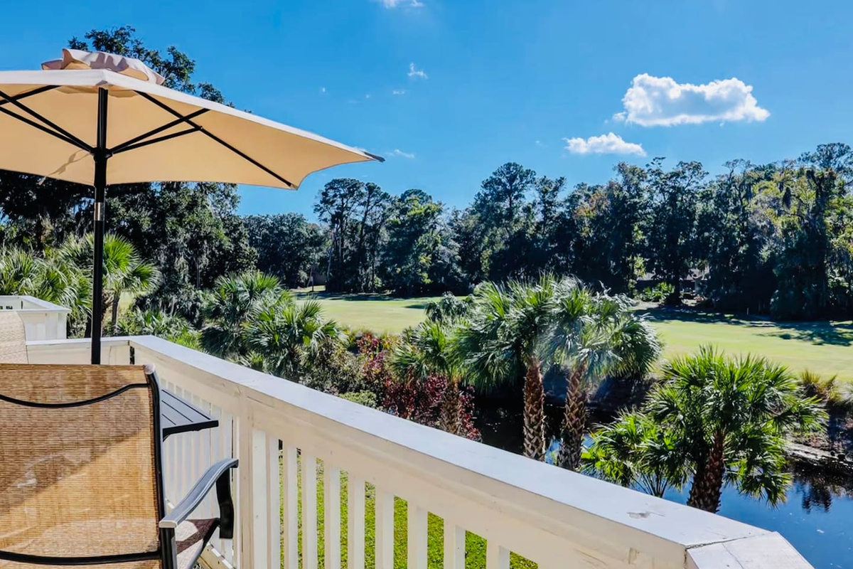Deck with views of the lagoon and golf course
