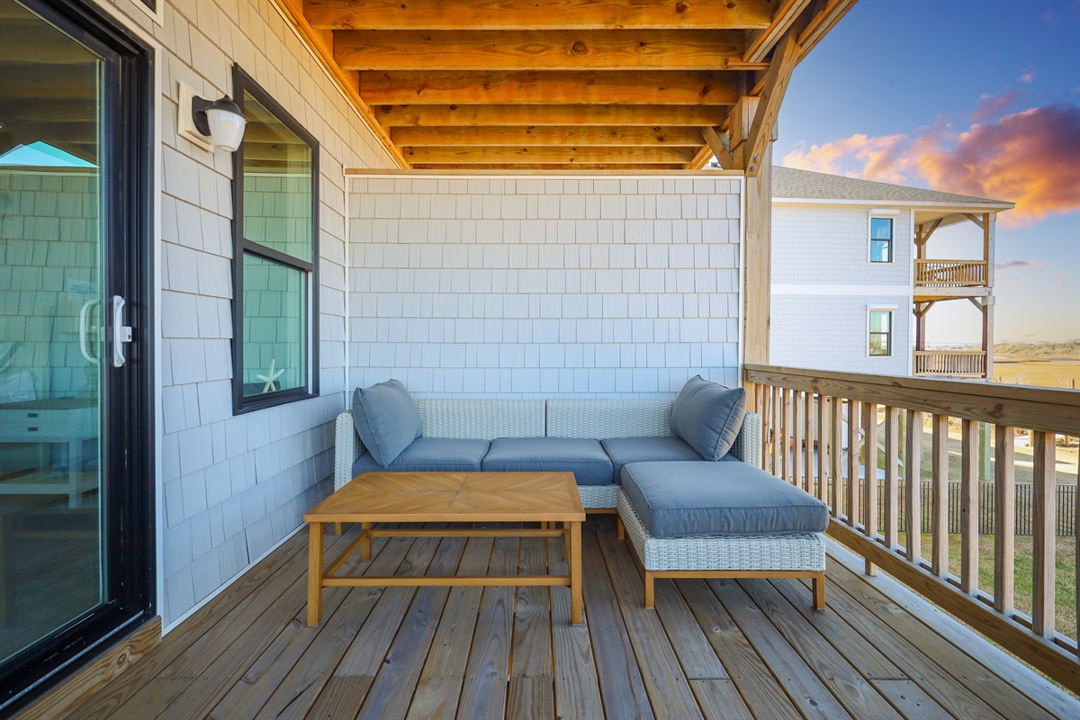Covered outdoor seating designed for laid-back evenings after a day at the beach
