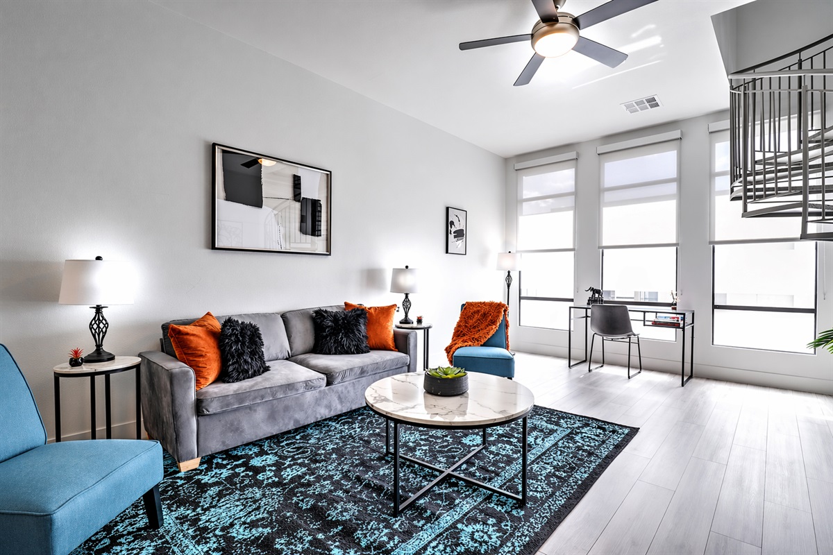 Stylish and comfortable living area featuring cozy seating, modern finishes, and a warm, welcoming ambiance. Ideal for relaxing, watching your favorite shows, or enjoying a quiet evening in.