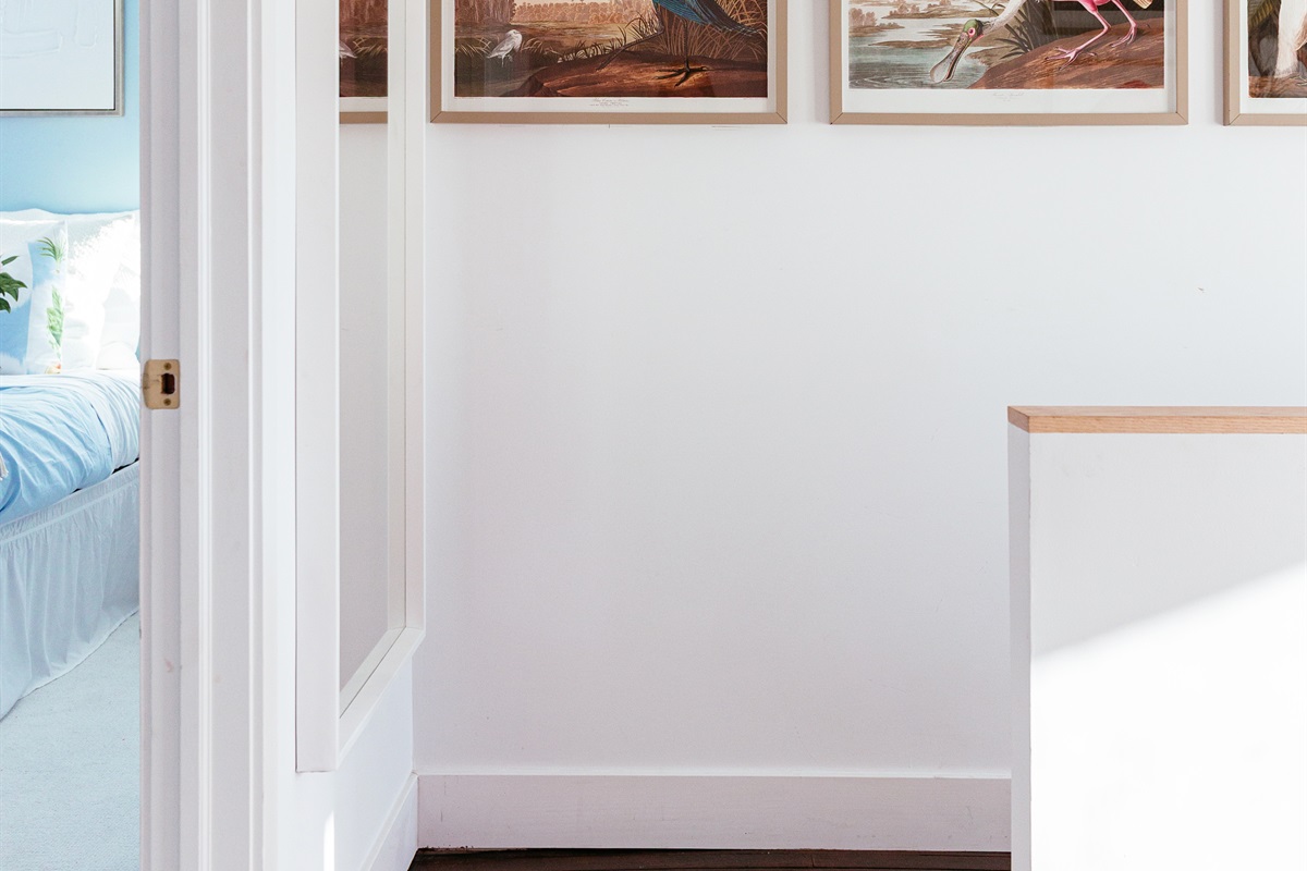 As you head upstairs, drawings of fowl local to the area bring the outdoors inside.