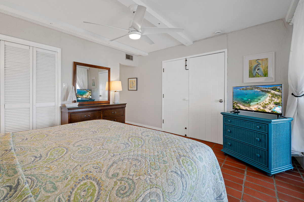 A peaceful primary retreat offering plenty of space to relax after a day at the beach.