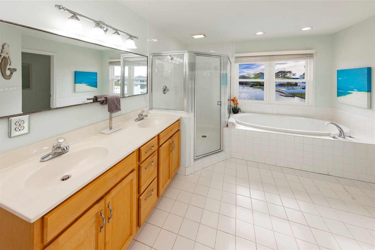 Spacious master en suite bathroom with a private toilet room