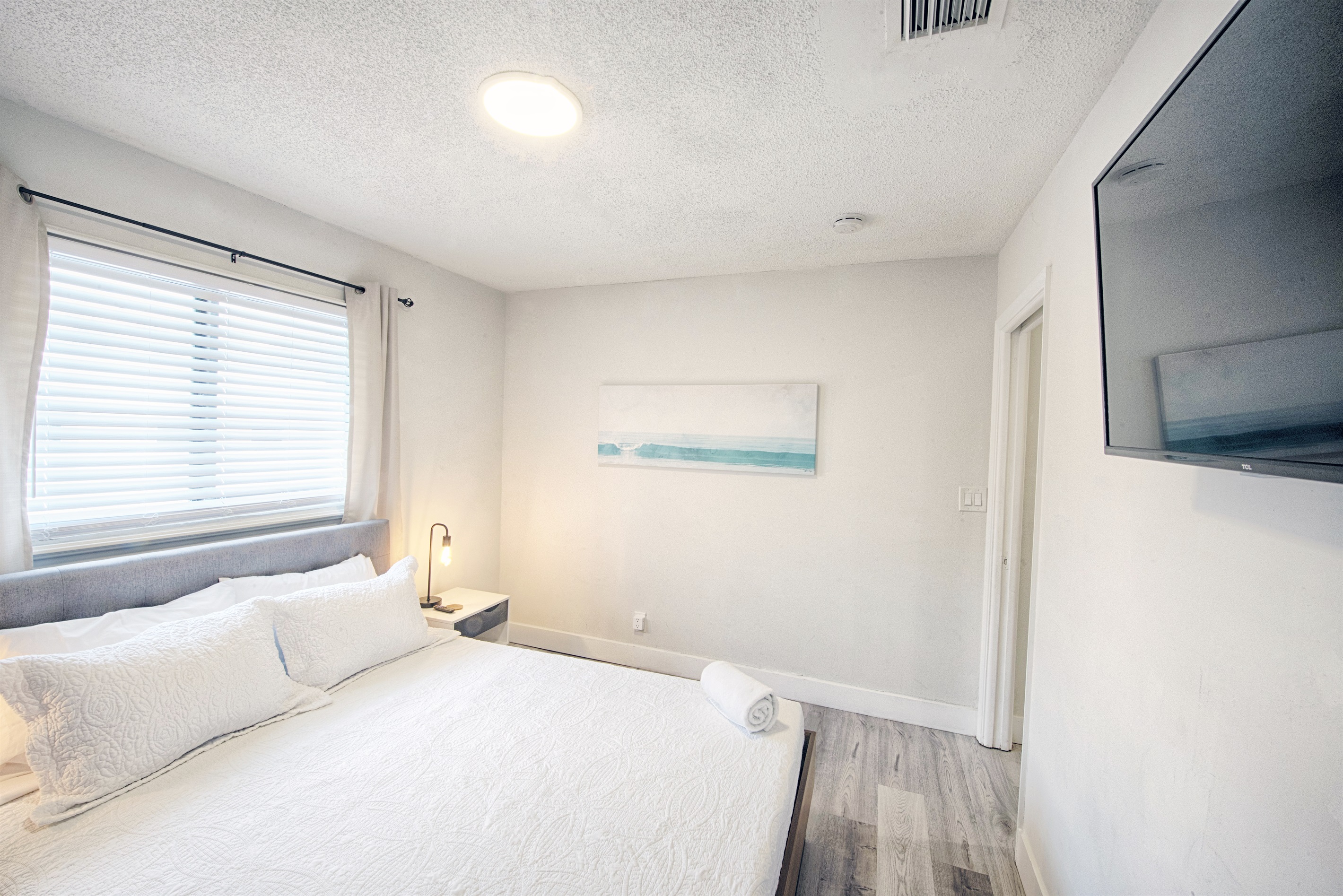 Welcome to your guest bedroom with (very) partial ocean view...close enough to see the breaking waves.