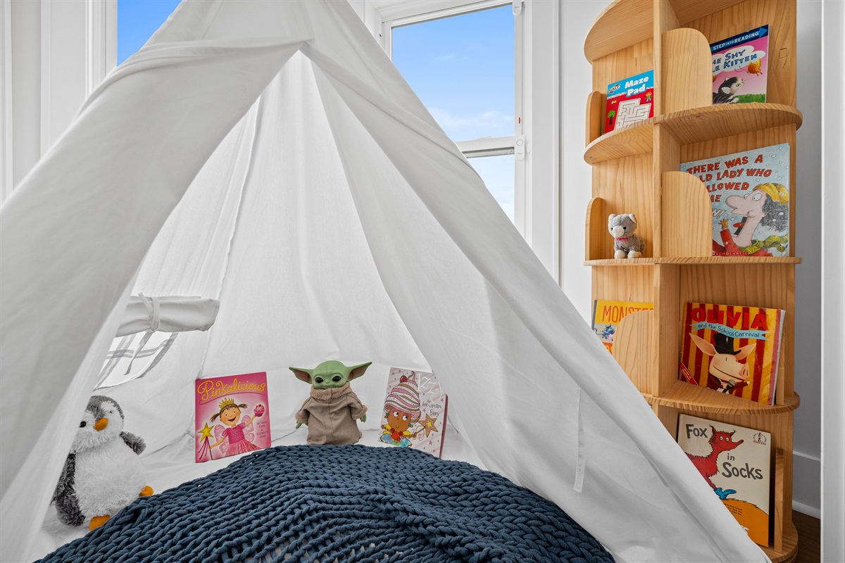 Charming kids&rsquo; reading nook adds a fun and cozy space for little guests to enjoy