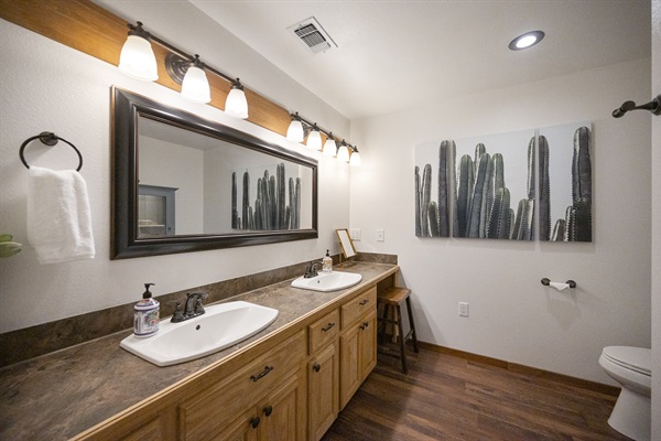 Master bathroom with double vanity and walk in shower.