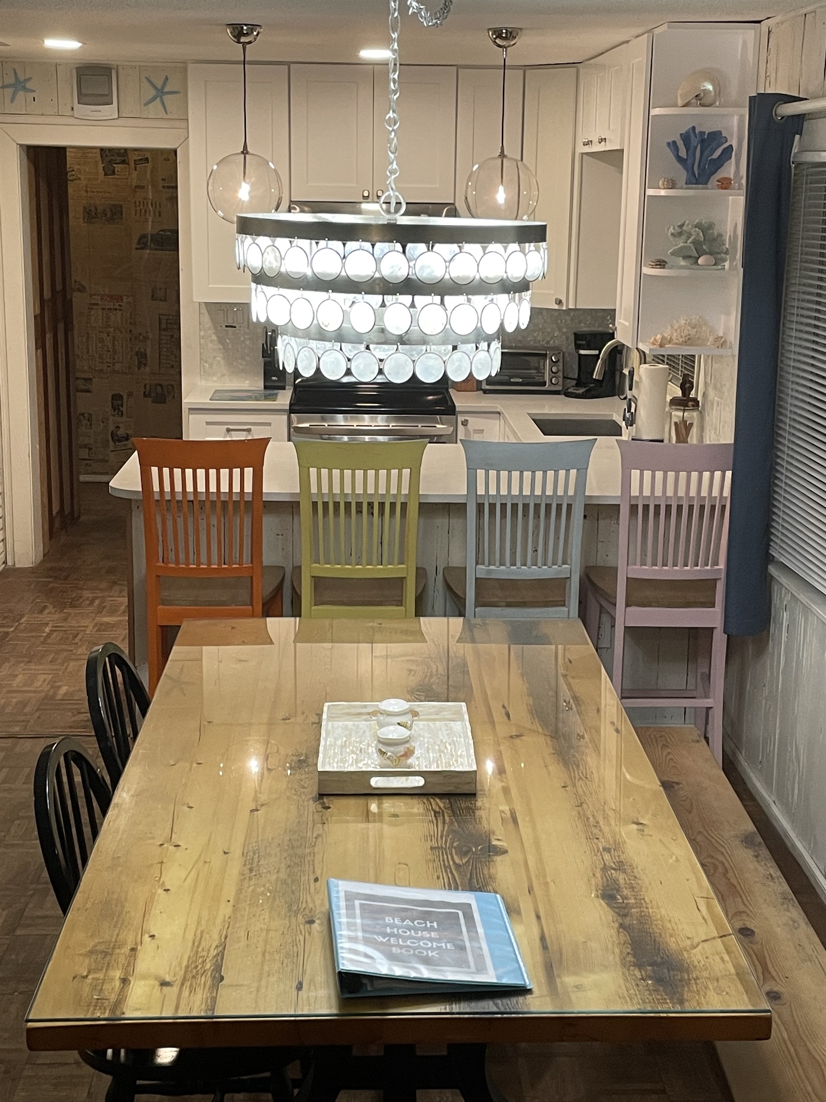 Capiz chandelier, Restoration Hardware Pendant Lights, 100 year old reclaimed hardwood table.