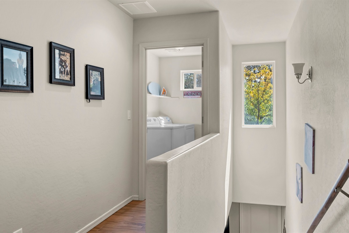 The upstairs landing provides a transition from the stairs to the hallway, leading you effortlessly to the laundry room.