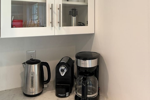 Coffee & tea station with a drip coffee maker and a Nespresso machine. Coffee and tea provided!