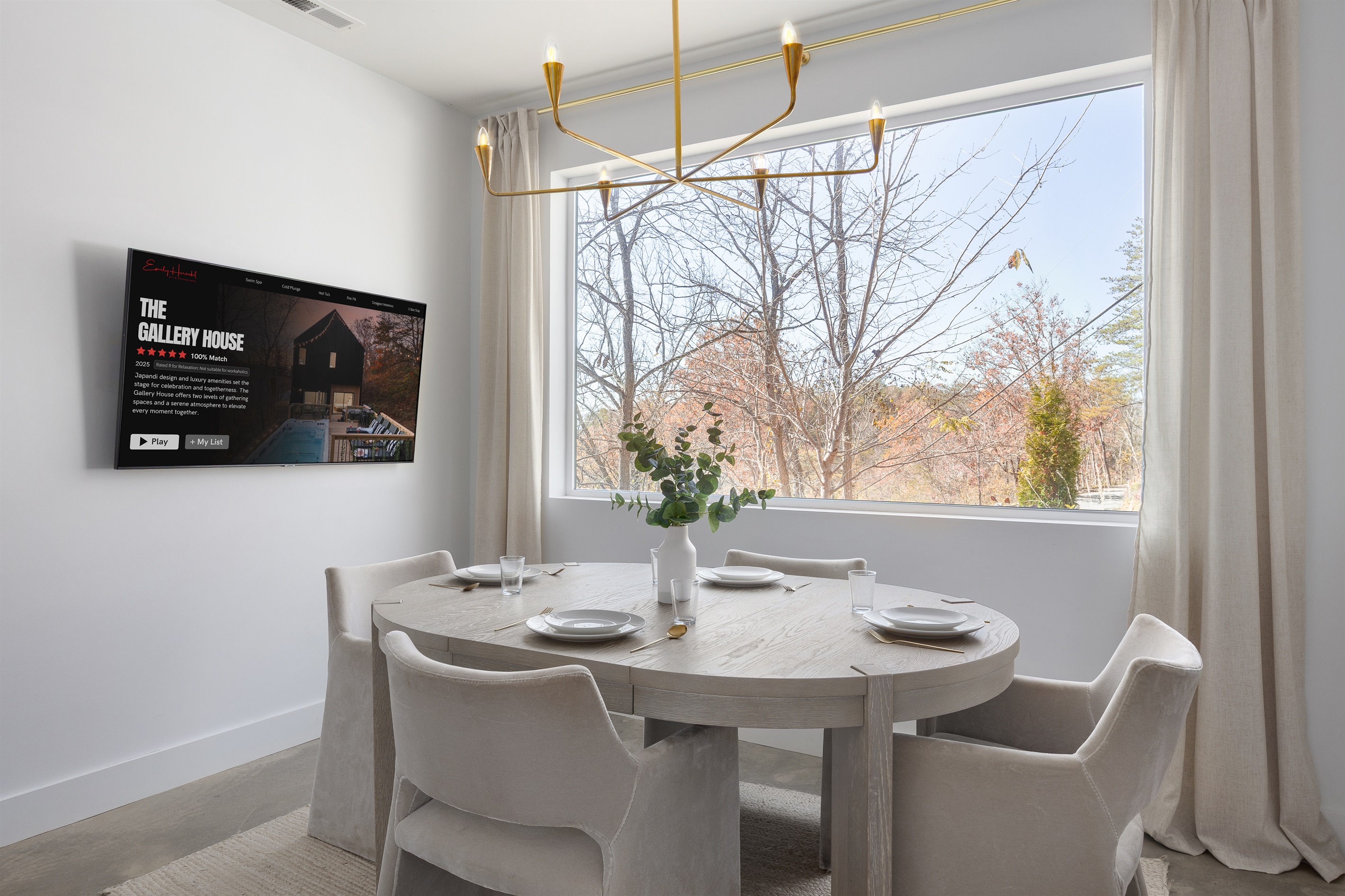{Downstairs Gathering Area} Cozy lounge with plush seating, Smart TV for movie nights, and treetop views that make even rainy days feel like a retreat.