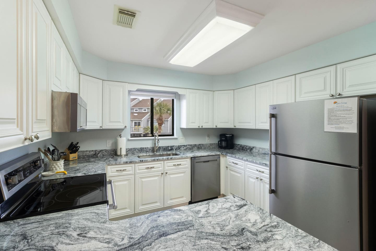Cook a real vacation meal in this fully equipped kitchen &mdash; stainless appliances, everything you need already here.