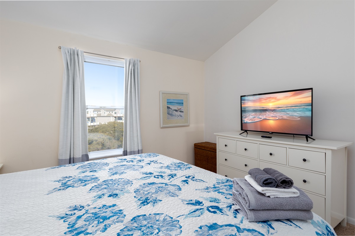 Bedroom with panoramic TV and view of the outdoors