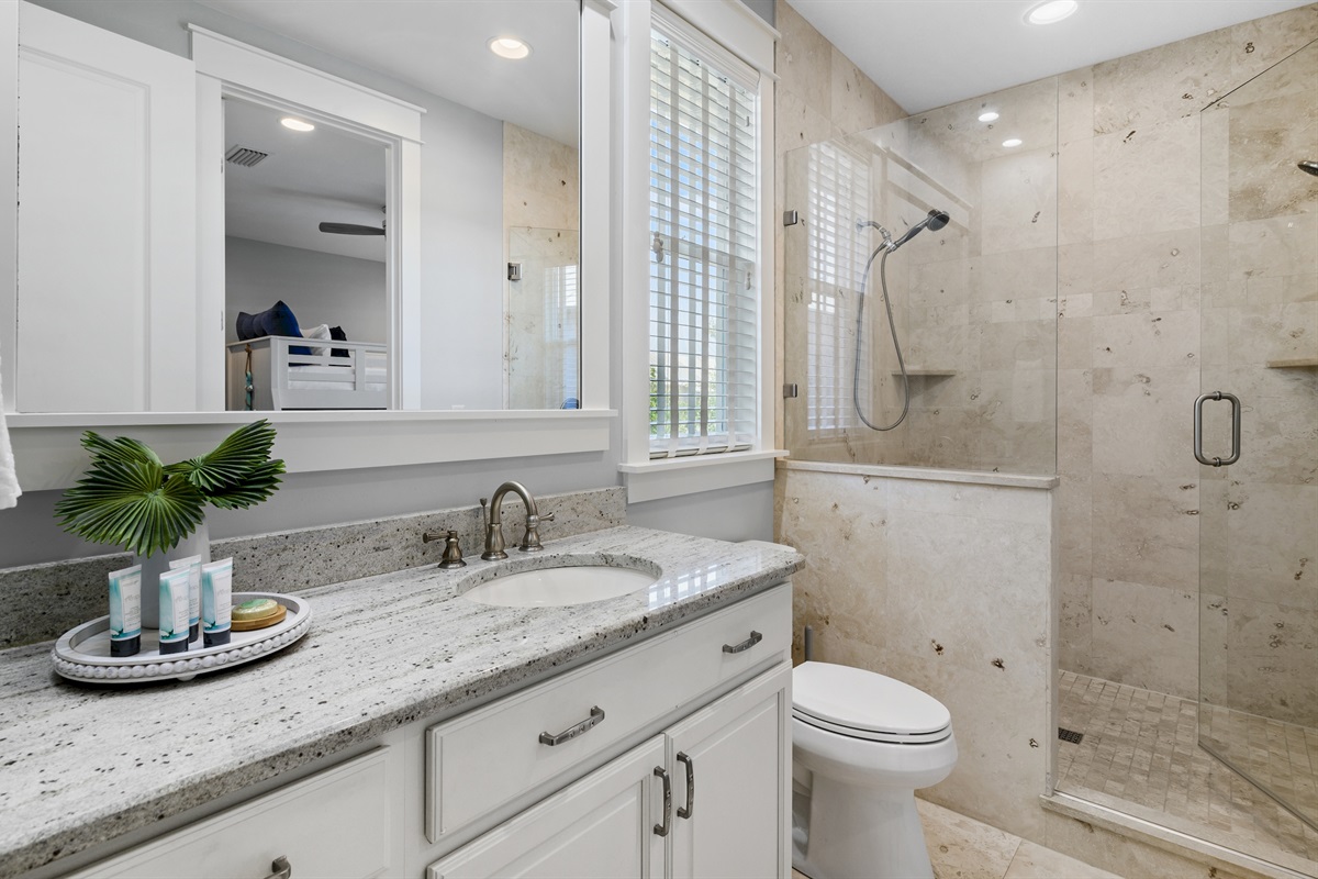 Shared bathroom with fresh coastal colors.