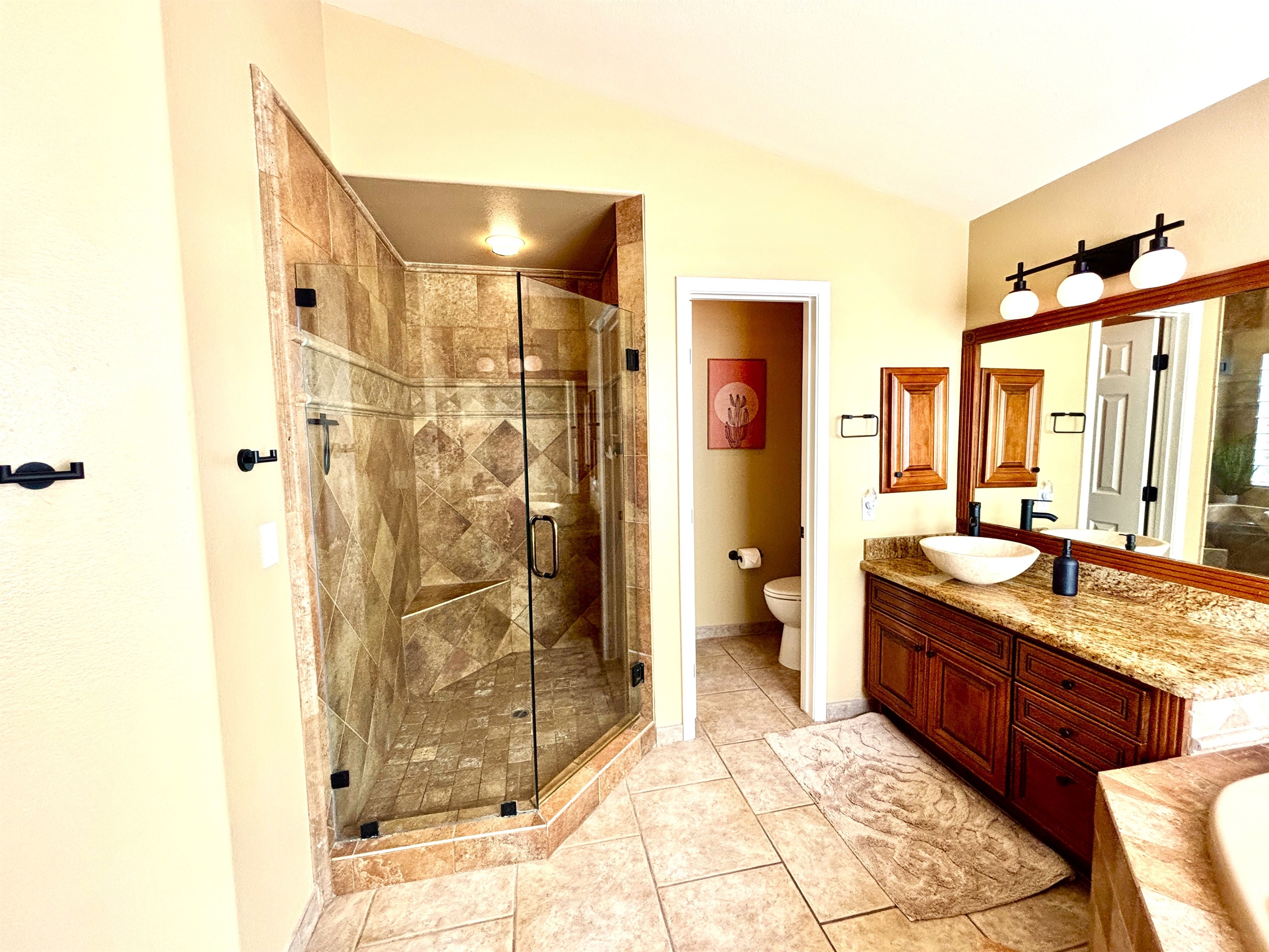 Primary Suite Bathroom with shower and bathtub