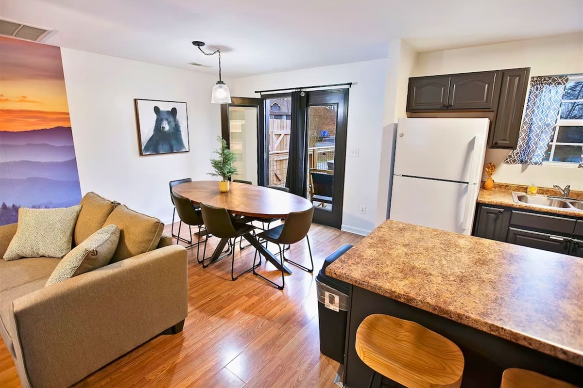 Savor the open-plan living, where the kitchen's delights are just steps away from the comfort of the couch and the beauty of the outdoors.