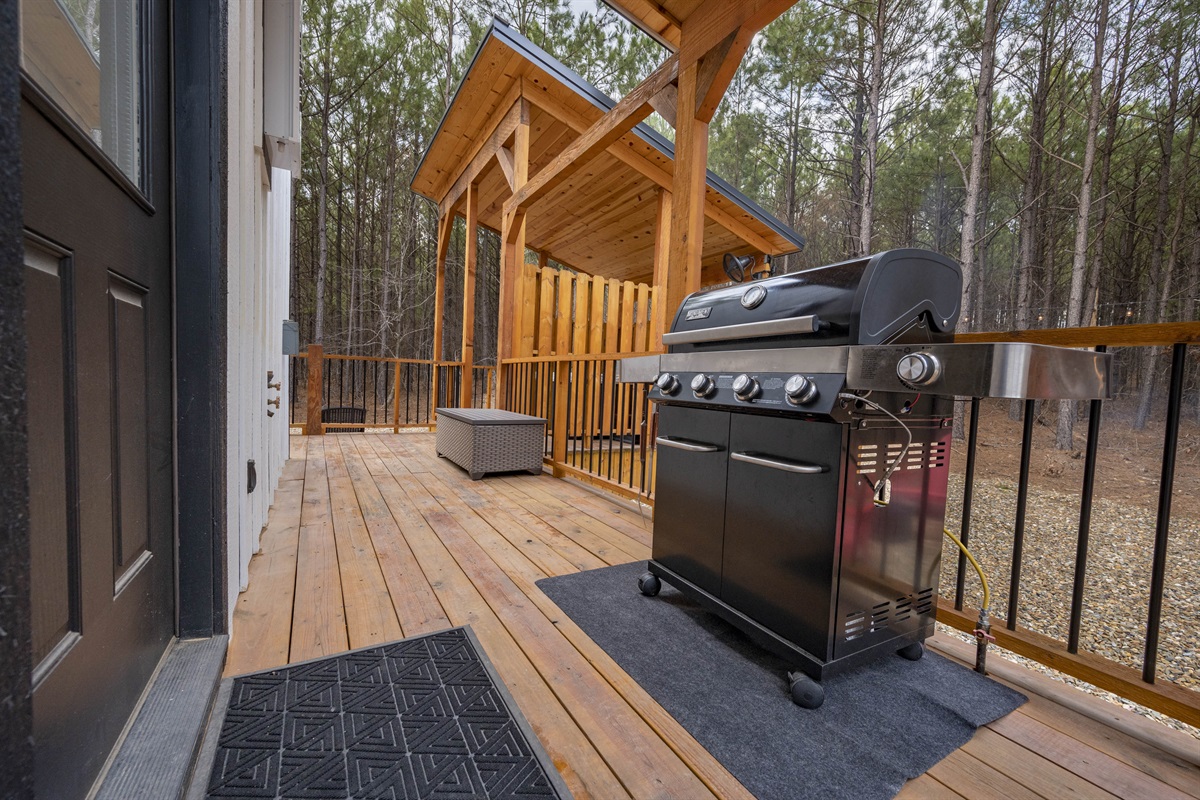 Grill located right outside the kitchen door. Propane is hard lined in so you don't have to worry about switching out tanks.