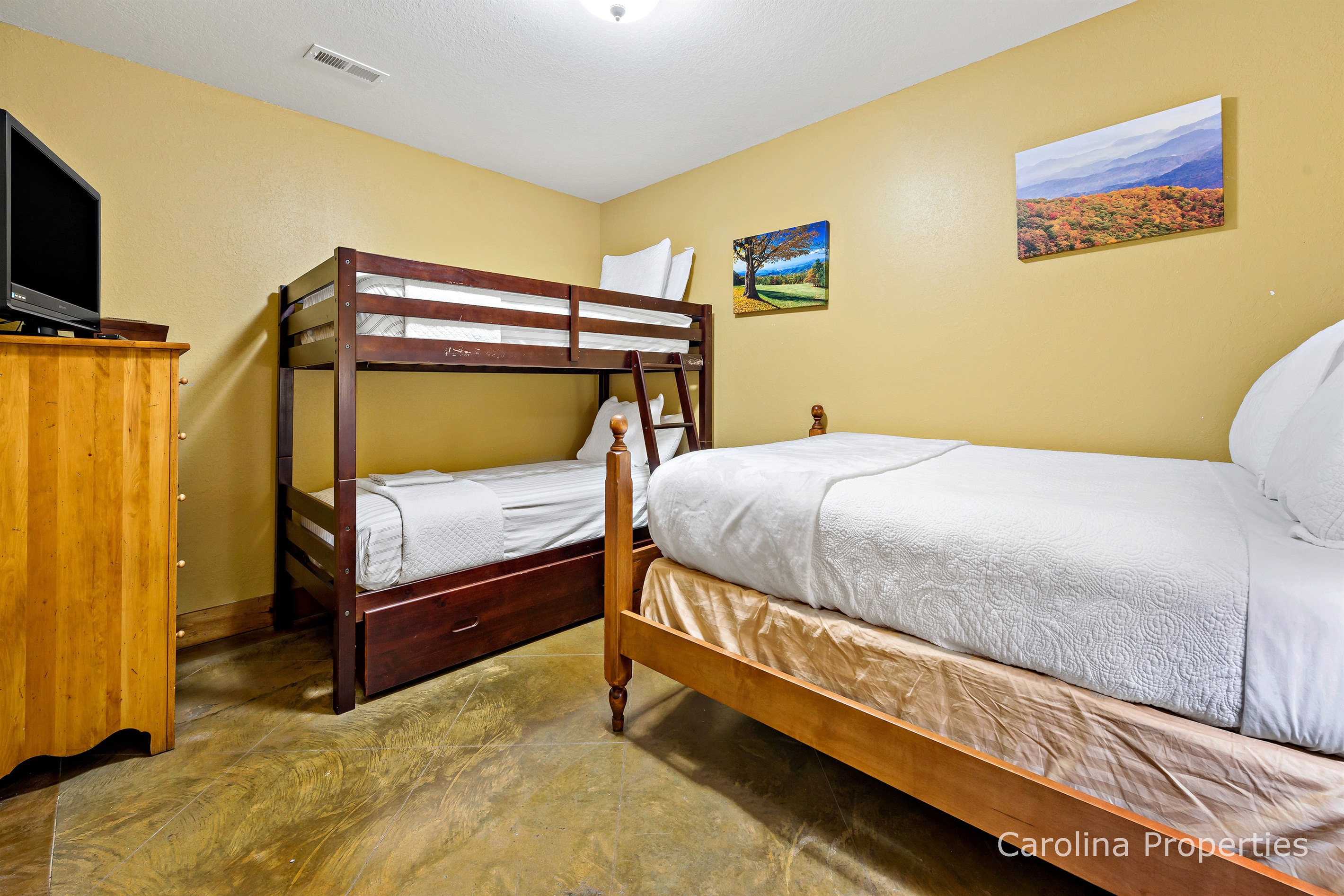bedroom with bunk bed and additional bed perfect for kids
