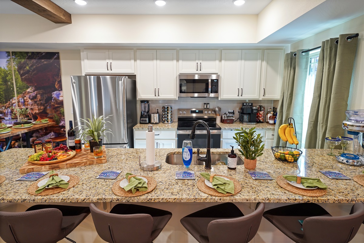 The fully stocked kitchen is perfect for preparing a meal and staying connected with everyone
