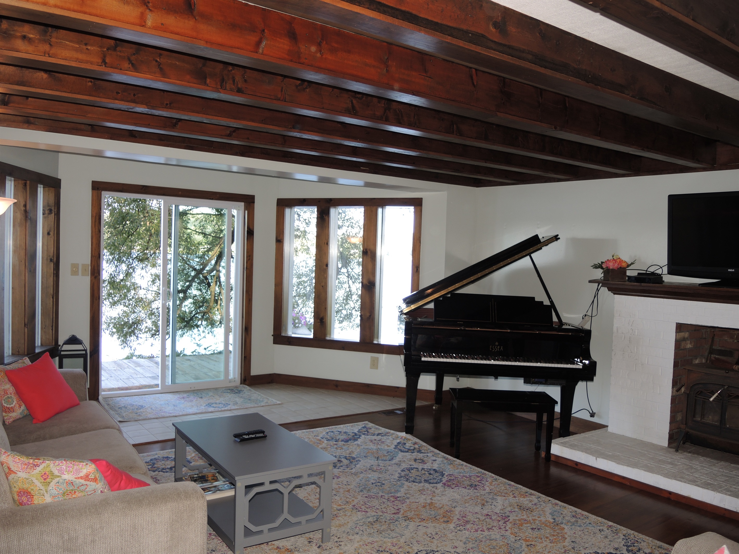 Living room with doors to rear deck overlooking lake