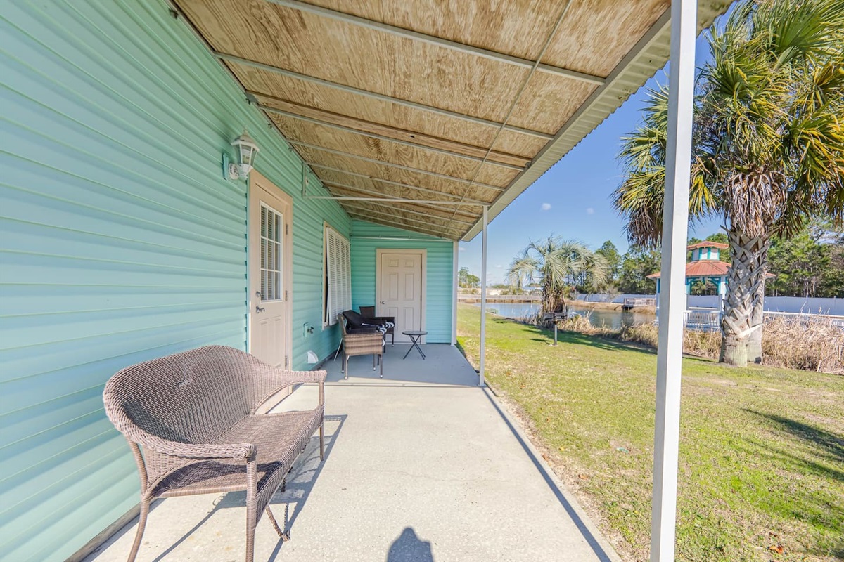 Porch Retreat: Sip your morning coffee on the shaded porch with serene water views!
