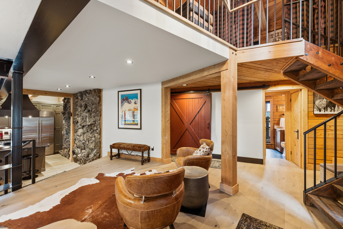 Wet bar area with half bathroom in background