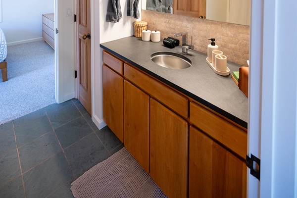 Clean and well maintained bathroom with fresh towels and essential amenities