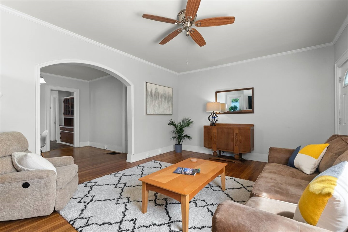 Spacious living room with recliner chair and sleeper sofa