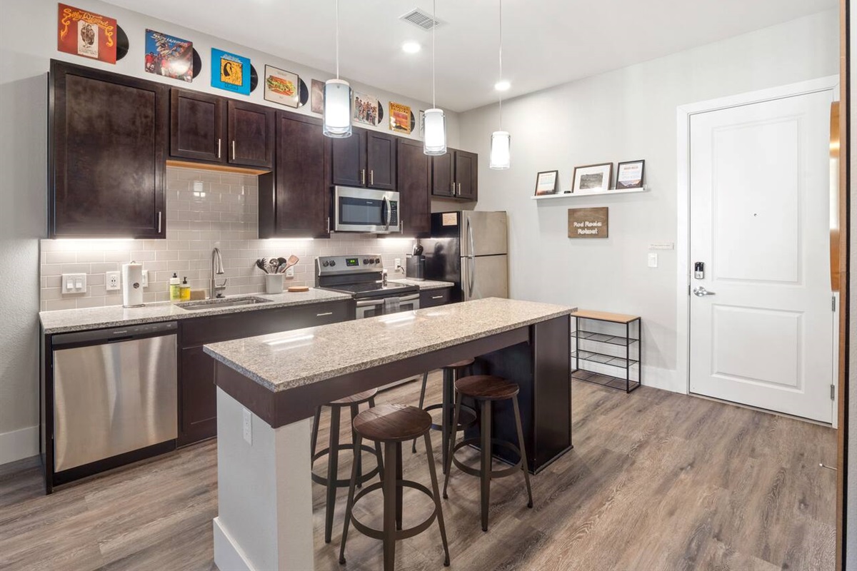 Spacious, open concept kitchen with everything you need for cooking! Keurig coffee maker. Pots, pans and baking dishes. Breakfast bar.