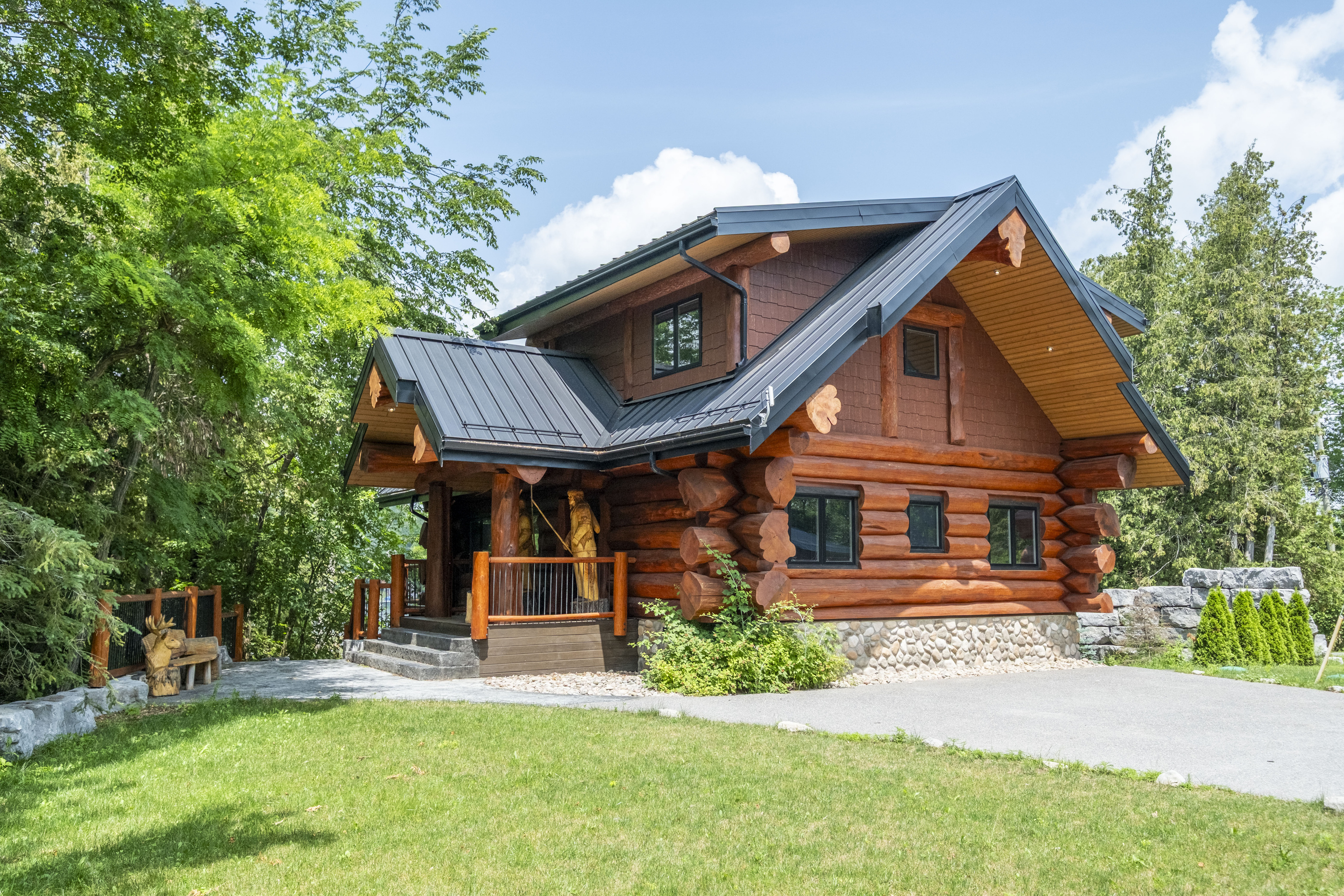 Front view of Bear Lodge surrounded by mature greenery