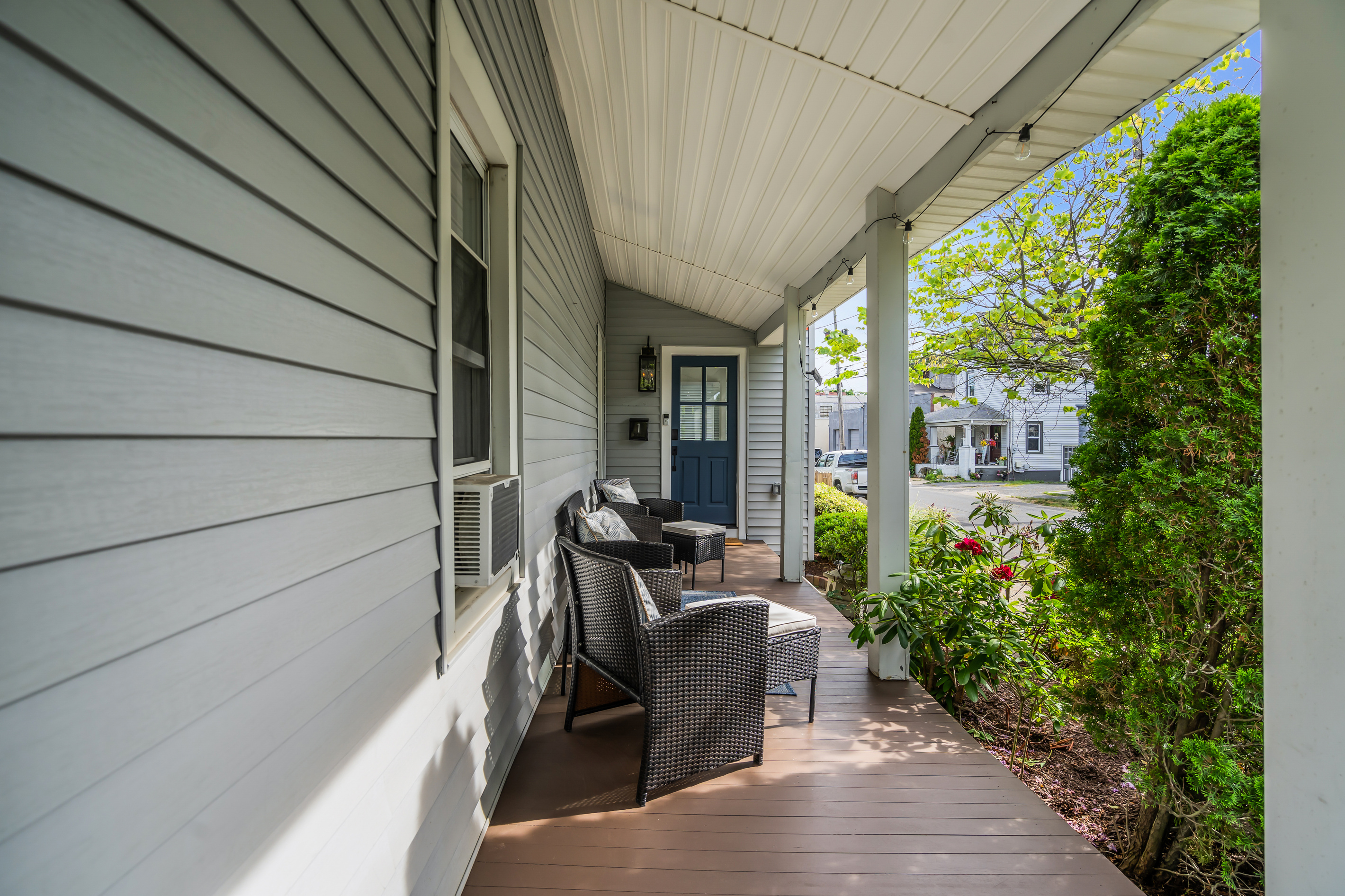 Stay on the porch as the day warms up. With the garden out front and the street quiet, this is the kind of slow start a real getaway is made for.