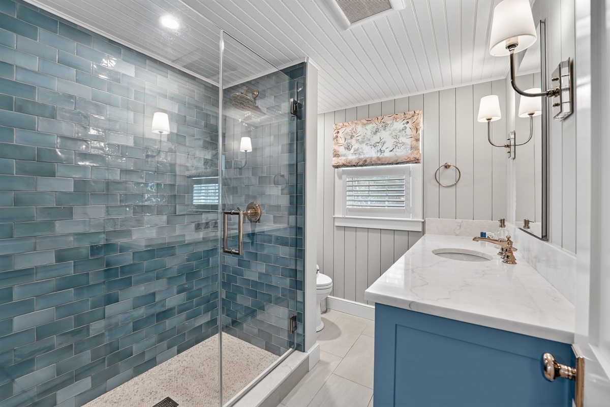 A neat and inviting full bathroom ready for your daily routine upstairs!