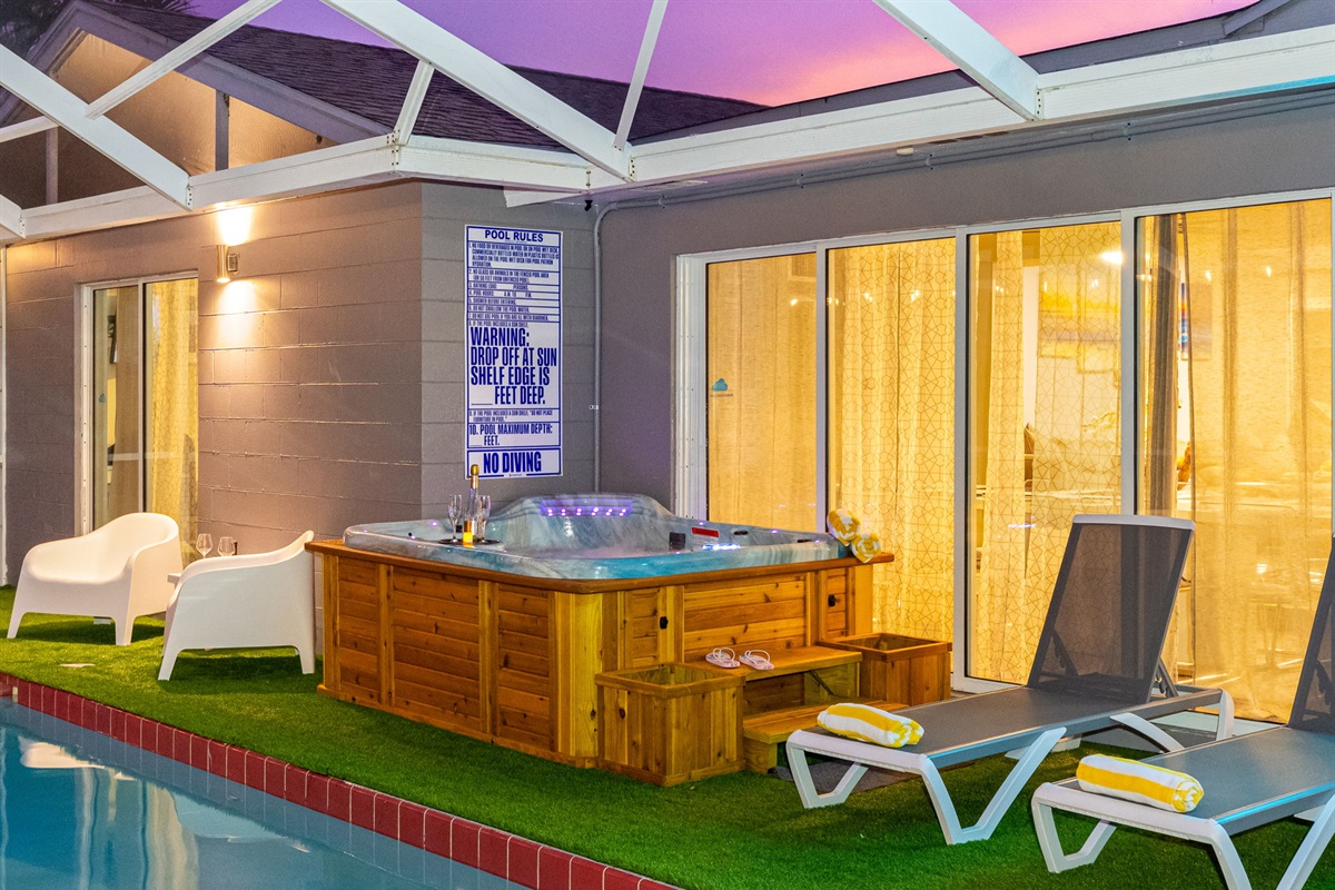 Settle into warm bubbling waters with a drink in hand, a view of the pool, and not a worry in sight.