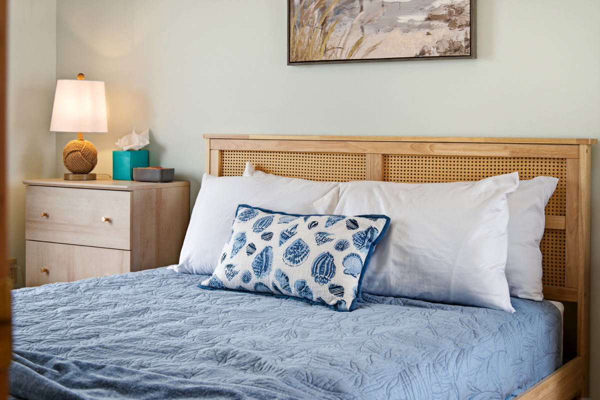 Comfortable queen bed with plush bedding for a restful night's sleep.