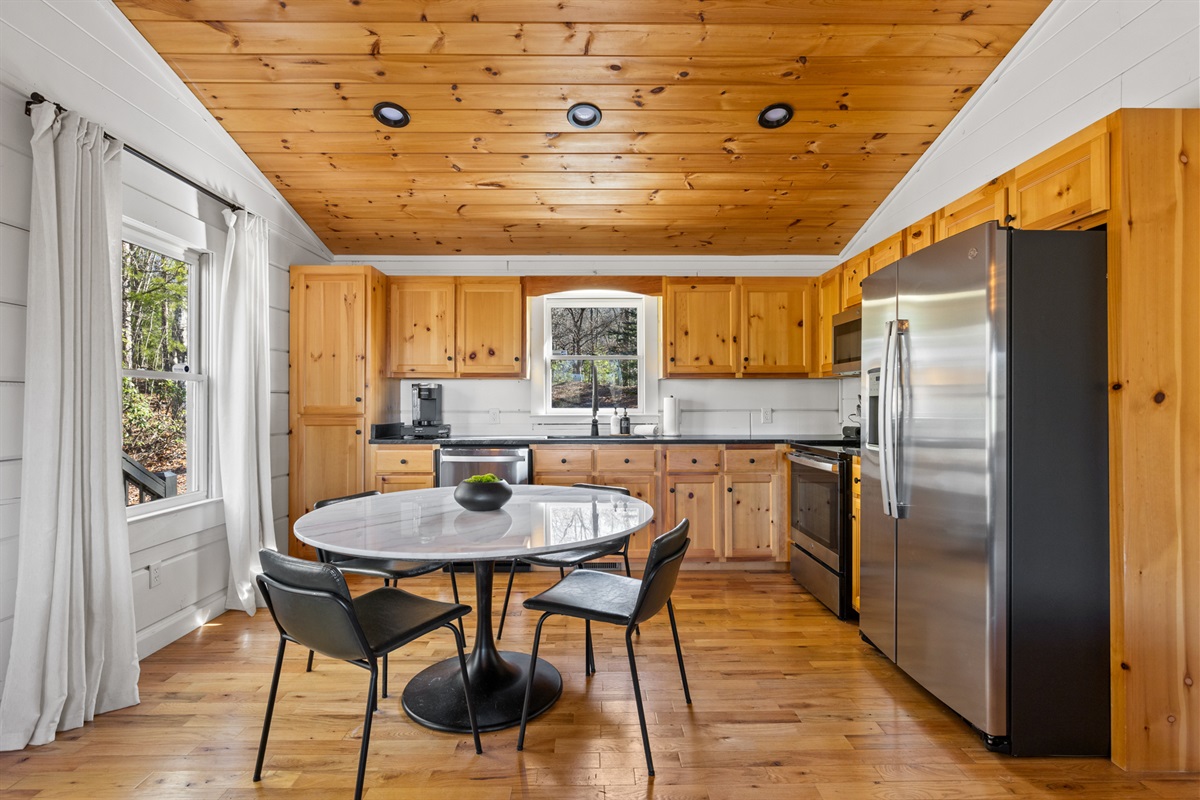 This bright and spacious kitchen is fully equipped to make cooking and dining a seamless experience.