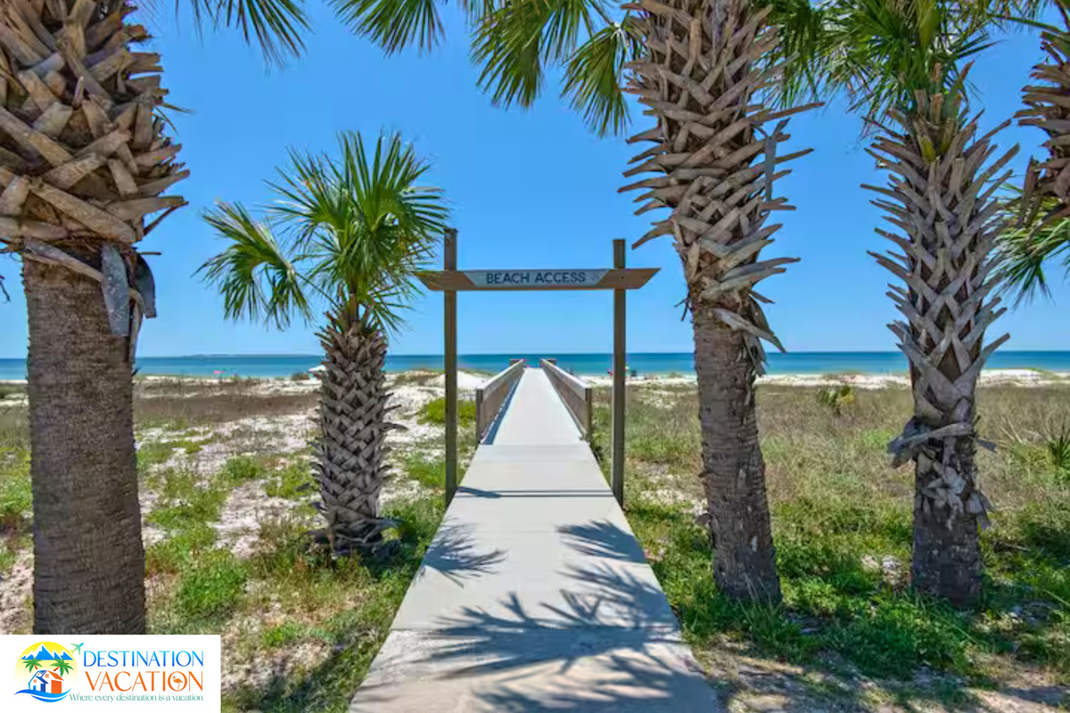 Stroll beneath palms toward sun, sand, and ocean.