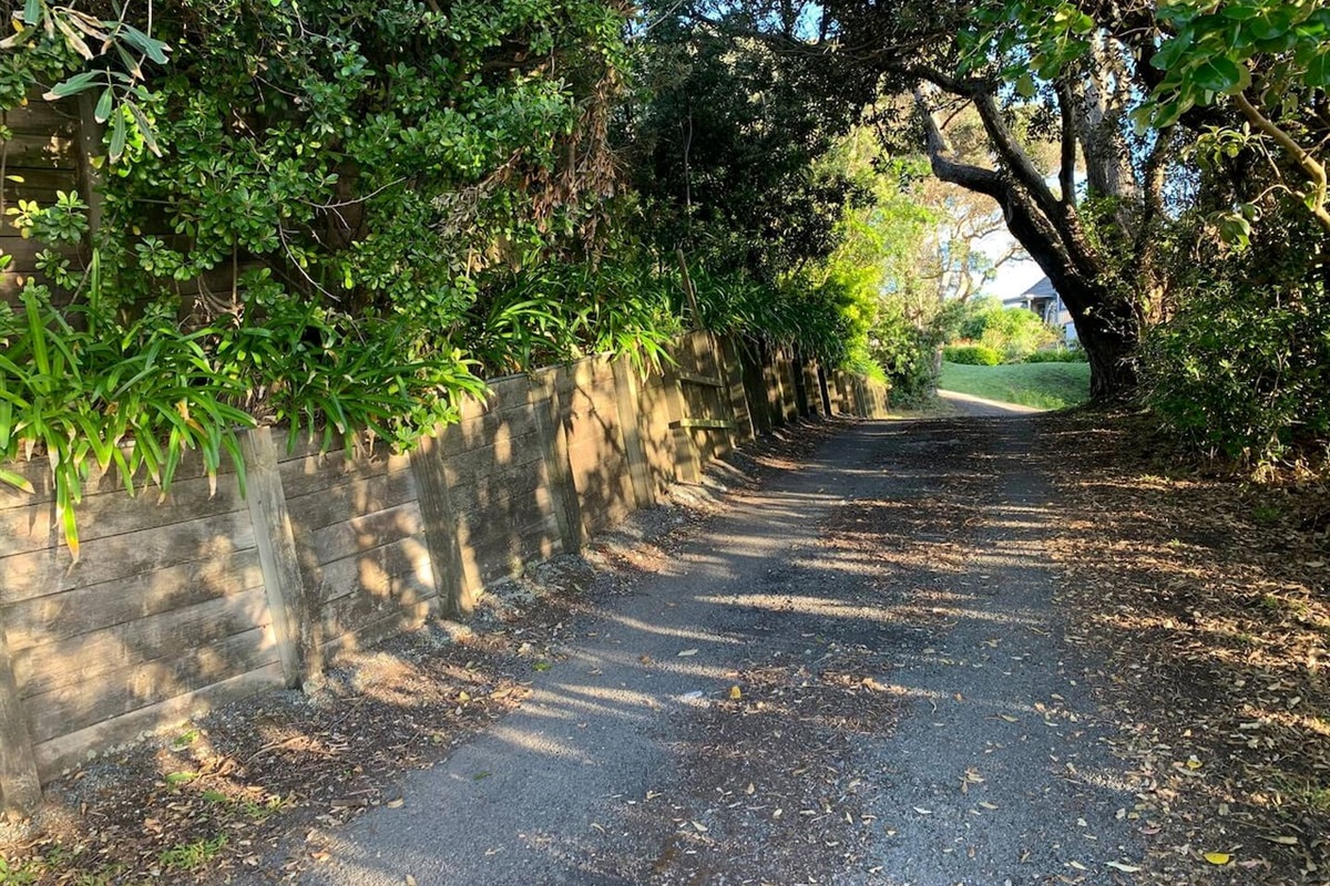 Wind your way up the tree-lined driveway to plenty of parking and turnaround at the Top 
