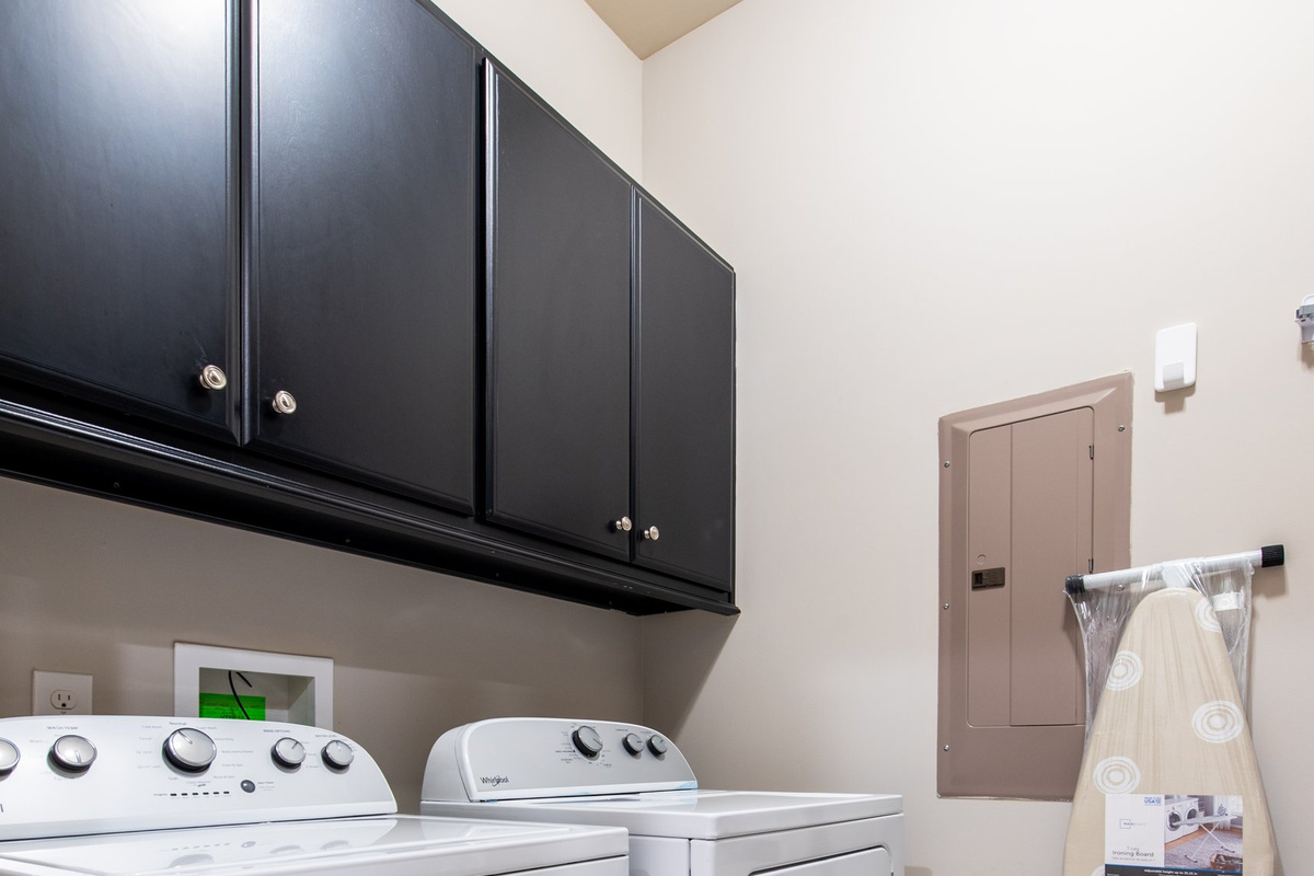 In-unit washer and dryer with cabinet storage - no laundromat runs needed.