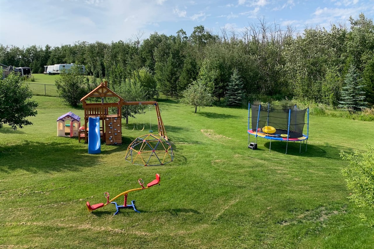 LOTS OF SPACE FOR YOUR LITTLE ONES TO PLAY. THE YARD IS NOT FENCED AND KIDS MUST BE SUPERVISED WHILE USING PLAYGROUND EQUIPMENT.