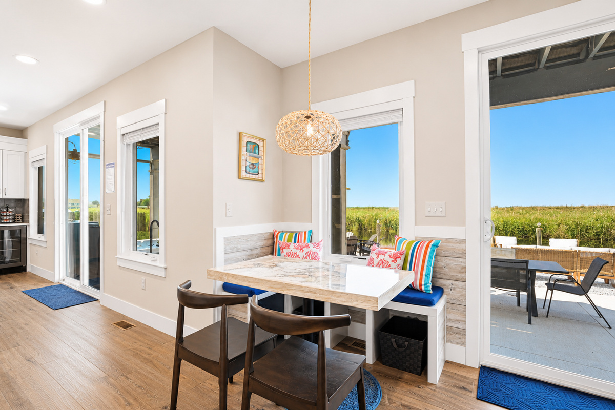 With patio access just steps away, this inviting dining space is perfect for family dinners, game nights, or enjoying fresh lake breezes between meals.