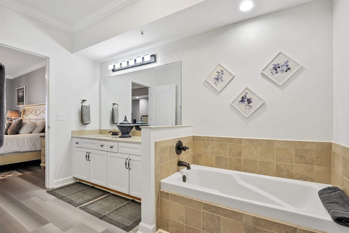 Master bath with jacuzzi, dual vanity, shower, toilet closet